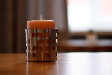 the pink candle on the table