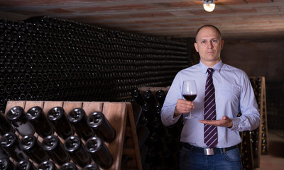 Winemaker proposing degustation of red wine