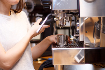 coffee machine girl brews coffee hands closeup and Turk coffee shop
