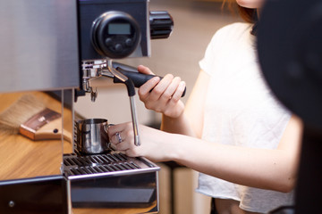 coffee machine girl brews coffee hands closeup and Turk coffee shop