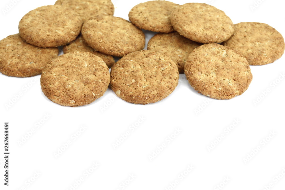 Wall mural Round whole wheat biscuit, cookie with raisins isolated on white background. Biscuits with whole-wheat (wholemeal) flour isolated on white background 