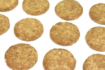 Round whole wheat biscuit, cookie with raisins isolated on white background. Biscuits with whole-wheat (wholemeal) flour isolated on white background 