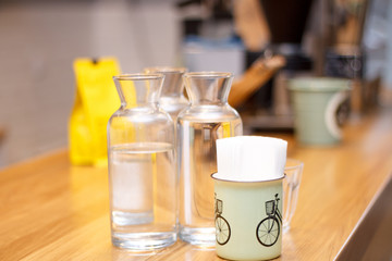 banks transparent and mugs on the background of coffee close-up