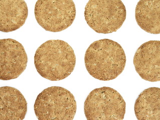Round whole wheat biscuit, cookie with raisins isolated on white background. Biscuits with whole-wheat (wholemeal) flour isolated on white background 