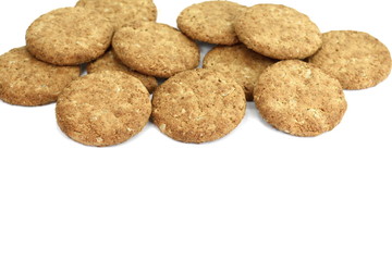 Round whole wheat biscuit, cookie with raisins isolated on white background. Biscuits with whole-wheat (wholemeal) flour isolated on white background 