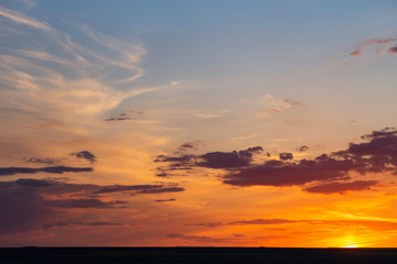 Landscape with bloody sunset. The terrain in southern Europe. Tragic gloomy sky. Purple-magenta clouds.