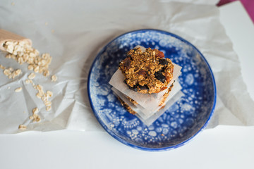 asty homemadeoats cookies decorated of blue satin ribbon on the creative bright blue plate