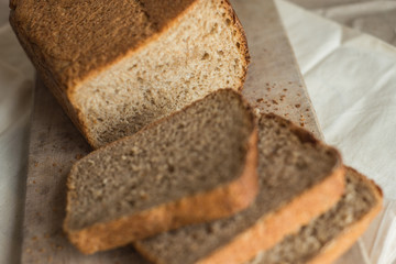 fresh homemade sourdough wheat form bread  served on the rustic background