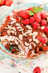 Traditional Italian Dessert with Raspberry Berries , cocoa, coffee and cheese masakropone. Tirmisu for homemade breakfast. Free space for text.