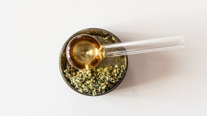 glass smoking tube for smoking marijuana buds. Female health & cannabis