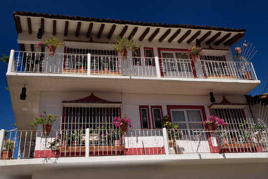 Three Story Hacienda In Downtown Puerto Vallarta With Flower Pots On Balcony