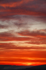 Gorgeous orange sunset colorful clouds in evening sky, natural beauty of nature