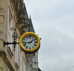Fototapeta na wymiar Clock on the historical street of Herford Germany.