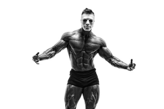 Mysterious Muscular man hiding behind white mask. Bodybuilder with white mask on his face. Studio shot on white background - Powered by Adobe