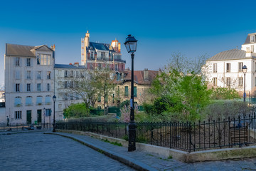 Montmartre in Paris, a very romantic parisian street and square with a vintage lamppost 