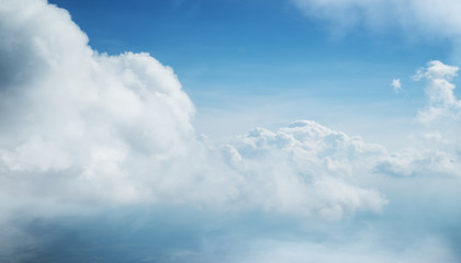Dramatic blue sky background with white clouds