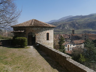 Malaspina Castle in Bobbio. It was built by Malaspina family as a fortress with a massive tower and it was later converted into a residence by Dal Verme family. It dominates the panorama of the Trebbi