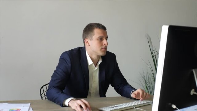 businessman working at a computer monoblock