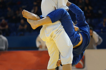 Pulling guard bjj Brazilian Jiu jitsu at the tournament fighters attacking passing stand up