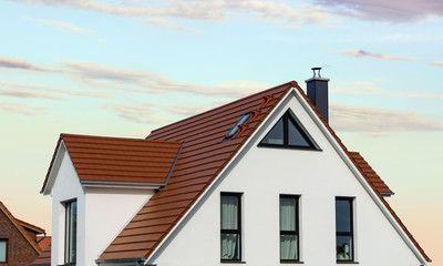 house with red roof - evening sky