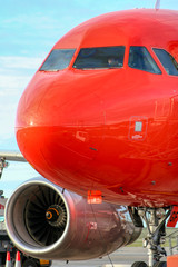 Big red aeroplane, pilots getting ready for take off vertical image
