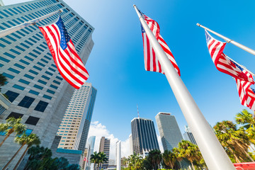 USA flags and skyscrapers in Bayfront Park in downtown Miami