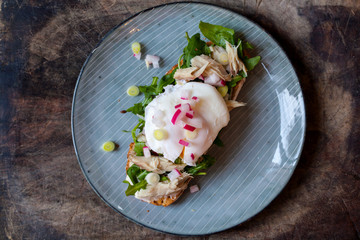 Open sandwich with salad, smoked mackerel and poached egg
