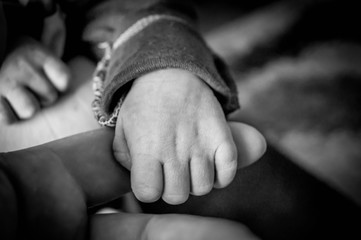 hands of mother and baby