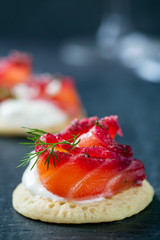 Party blinis with beetroot cured salmon, cream and horseradish 