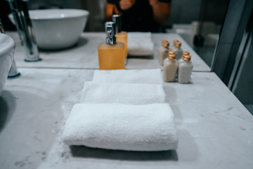 Close up of natural soap and bath towels