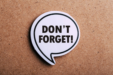Do not Forget Reminder Speech Bubble Isolated On Brown paper Background