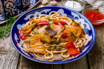 Lagman asian soup on wooden background