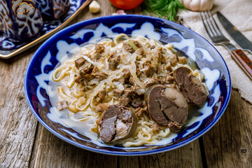 Beshbarmak, Uzbek kitchen on wooden background