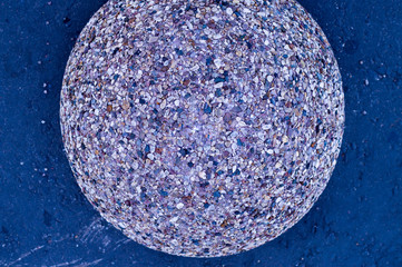 pebble stone circled texture on asphalt background