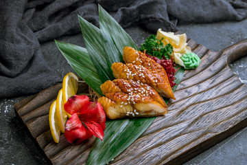 Sashimi eel on a board