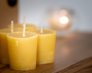 Bees wax candles for sale on display in a boutique honey shop