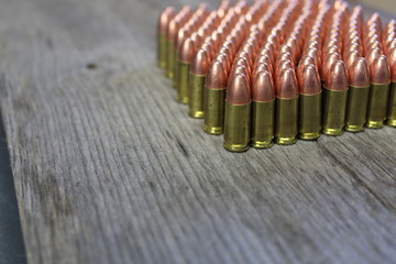 9mm bullets on barn wood table