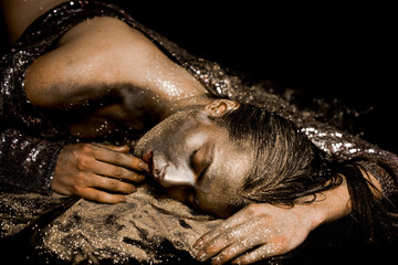 Spa wellness. Richness and wellbeing. Golden mask. Luxury beauty procedure. Pure gold. Golden lady relaxing. Vogue and glamour concept. Golden skin. Sexy girl face makeup body art metallized color