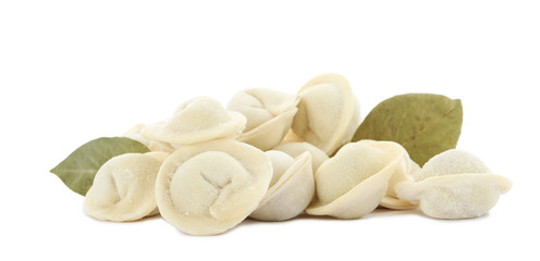 Raw meat dumplings with bay leaves on white background