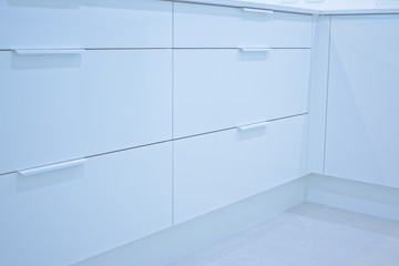 Closeup of closed drawers in a modern kitchen.
