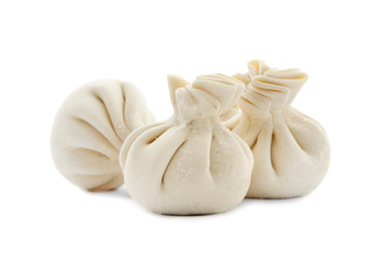 Raw dumplings with tasty filling on white background