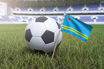 Aruban flag in stadium field with soccer football