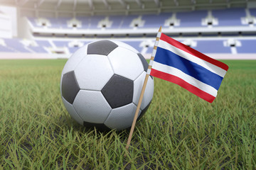 Fototapeta premium Thai flag in stadium field with soccer football