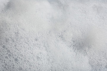 Obraz premium Soft white soap foam as background, closeup