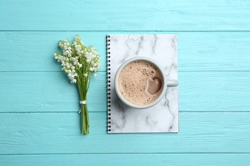 Fototapeta na wymiar Flat lay composition with notebook, lily of the valley bouquet and coffee on wooden background