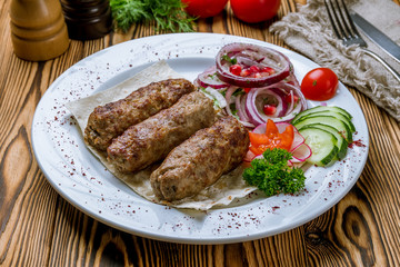 Lamb Lula kebab on white plate