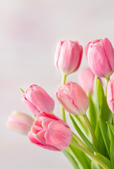 Pink spring tulips on a marbled background with copy space
