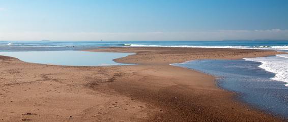 Sandbar where the Pacific ocean and the Santa Clara river meet at Surfers Knoll beach in Ventura California United States