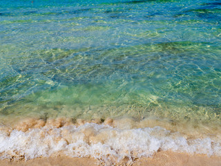 Beautiful clear blue water and clean sandy beach - small wave