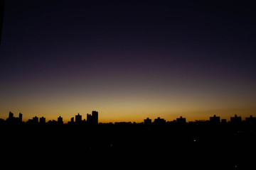 Sunset cityscape nightfall skyline